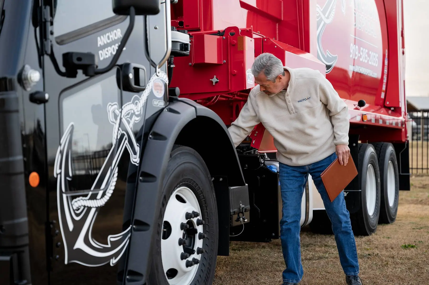 Tim inspecting truck operations