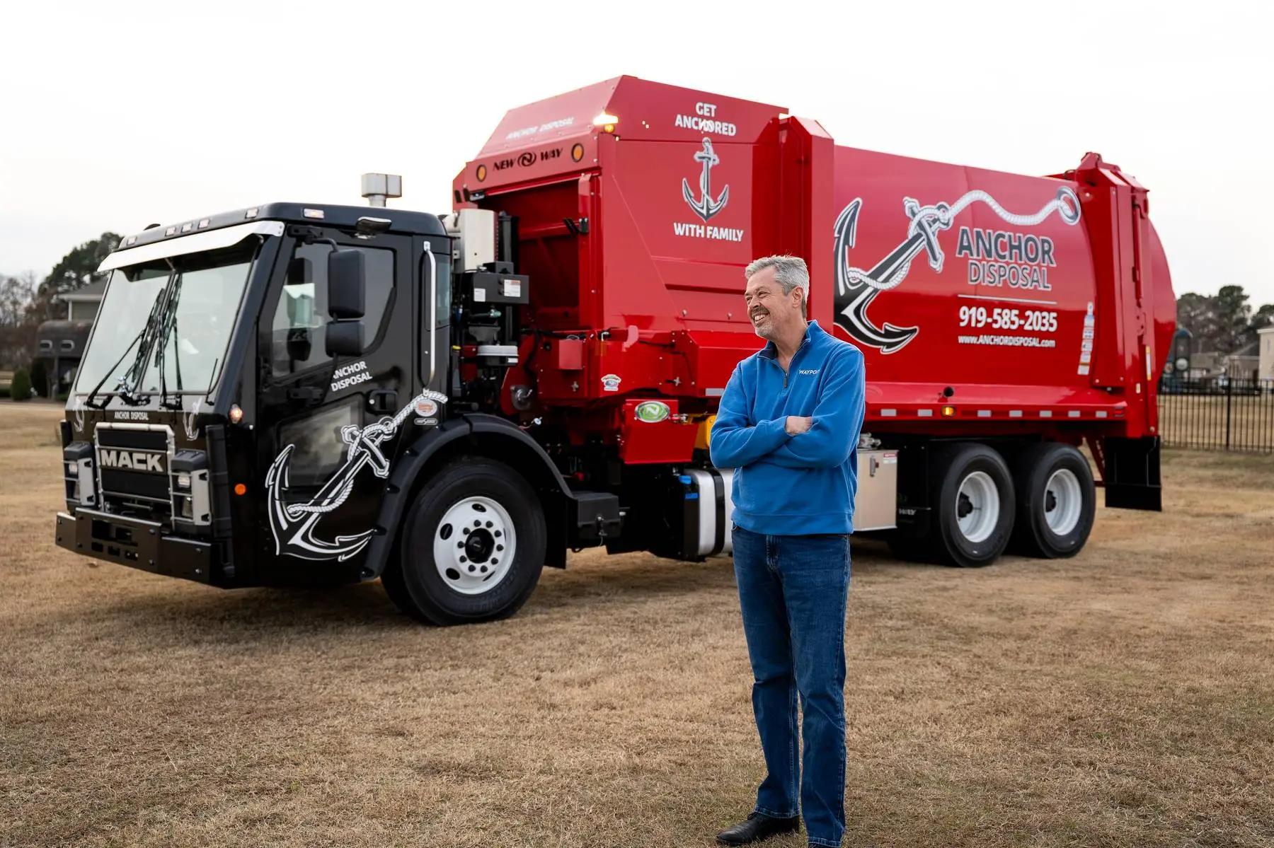 Tim Herman consulting with waste hauler